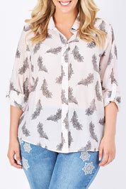 Model Jess wearing size L of the Printed Feather Shirt in colour PinkBlack (Pink), from the front, cropped image