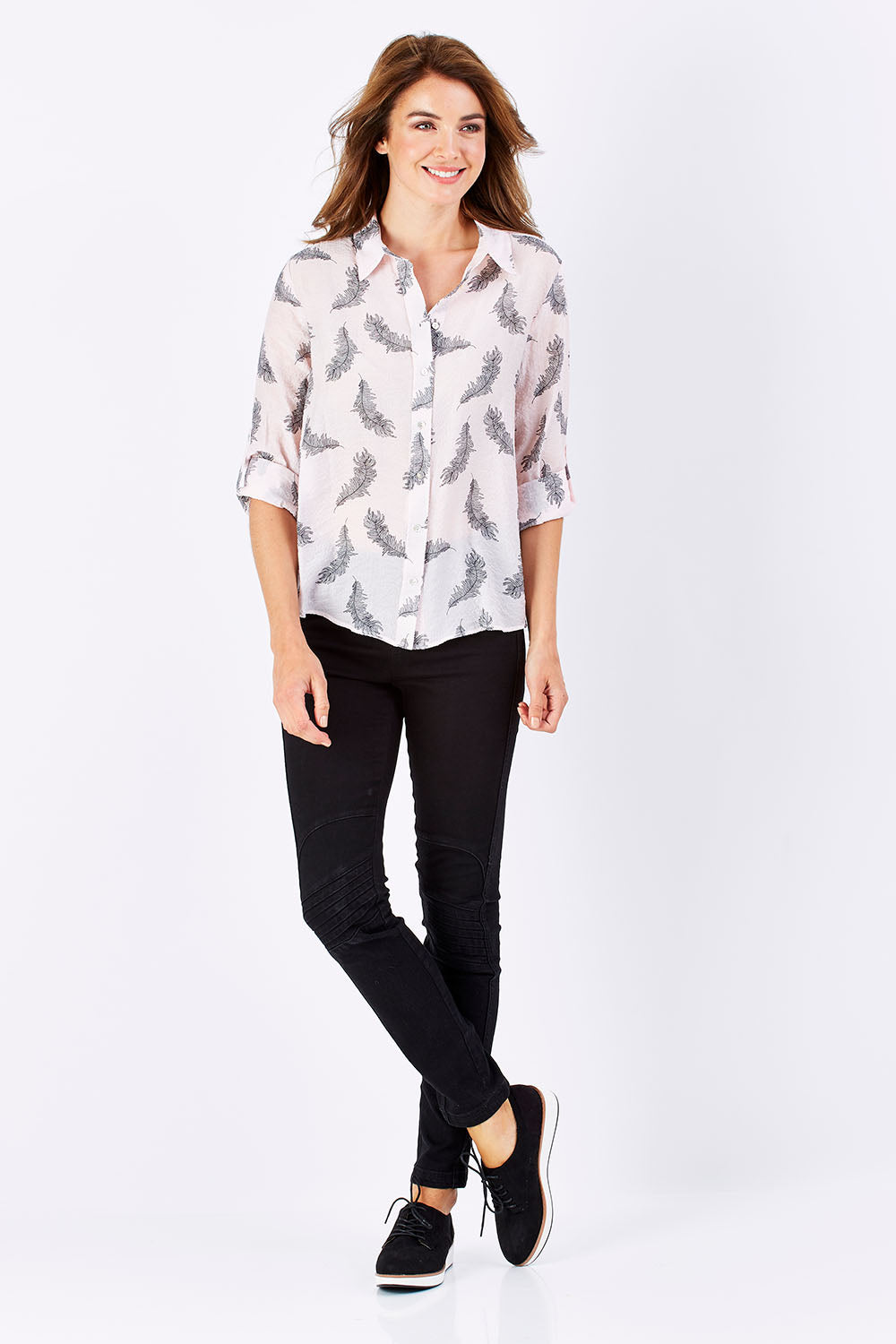 Model Rebecca wearing size S of the Printed Feather Shirt in colour PinkBlack (Pink), from the front, showing the whole outfit