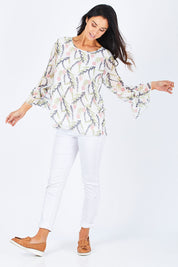 Model Gemma wearing size S of the Vine Print Top in colour WhiteMulti (White), from the front, showing the whole outfit