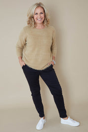 Model Sandy wearing size S of the Jogger Jean in colour Black (Black), from the front, showing the whole outfit