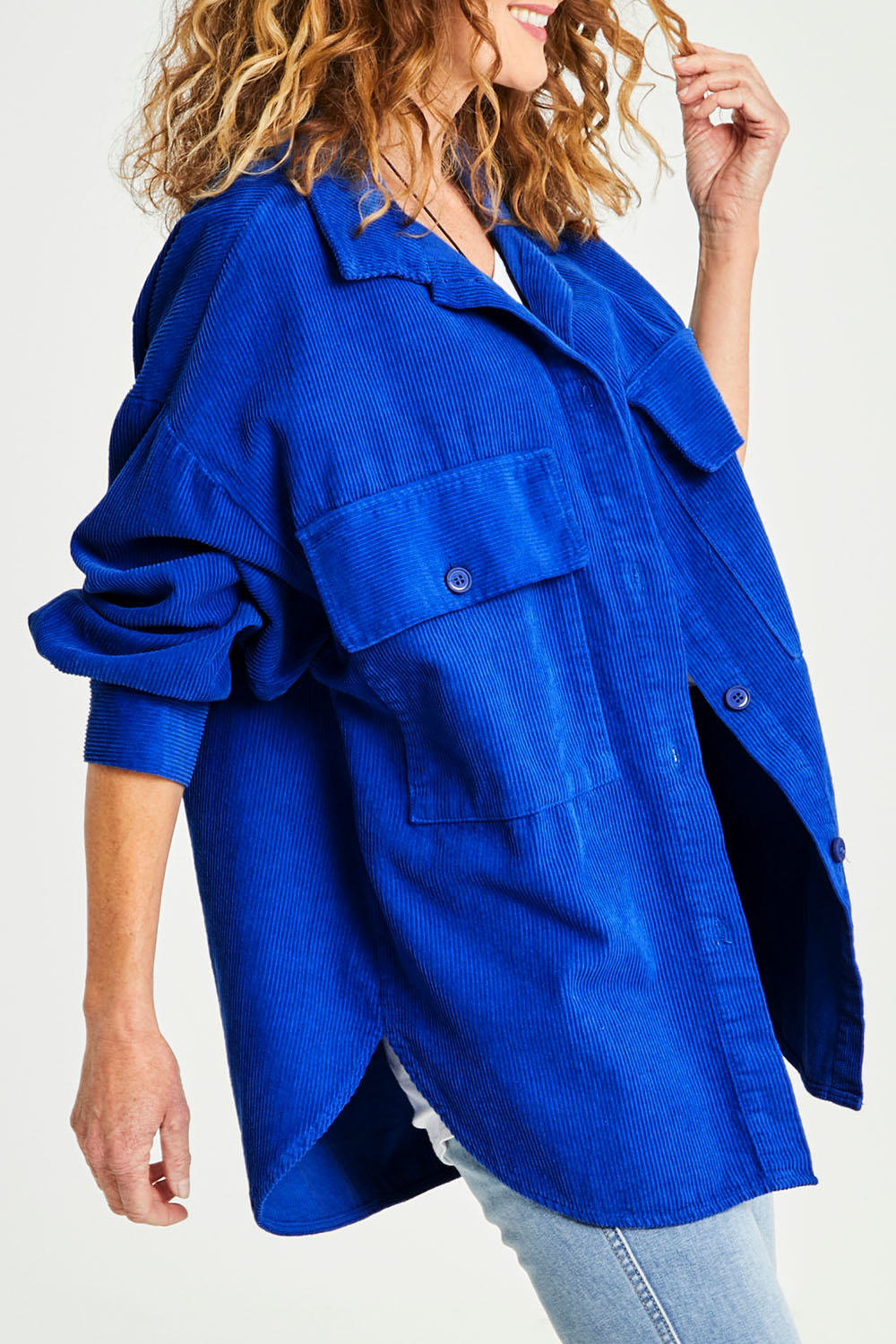 Model Emma wearing size S of the Zoe Cord Shacket in colour Cobalt (Blue), from the front, cropped image