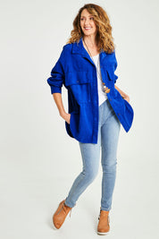 Model Emma wearing size S of the Zoe Cord Shacket in colour Cobalt (Blue), from the front, showing the whole outfit