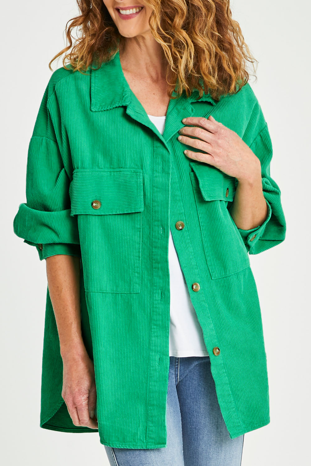 Model Emma wearing size S of the Zoe Cord Shacket in colour Jade (Green), from the front, cropped image