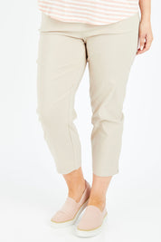 Model Jess wearing size L of the Zara Pant in colour Natural, from the front, cropped image