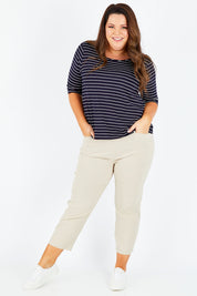 Model Stacey wearing size XL of the Zara Pant in colour Natural, from the front, showing the whole outfit