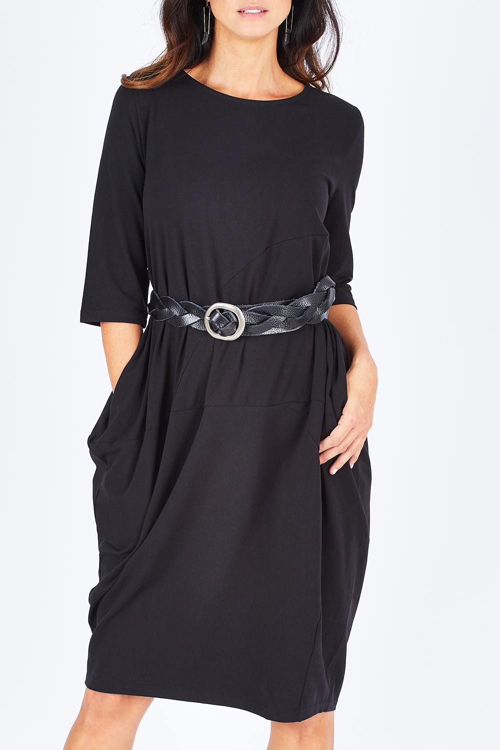 Model Gemma wearing size S of the Curved Seam Dress in colour Black (Black), from the front, cropped image