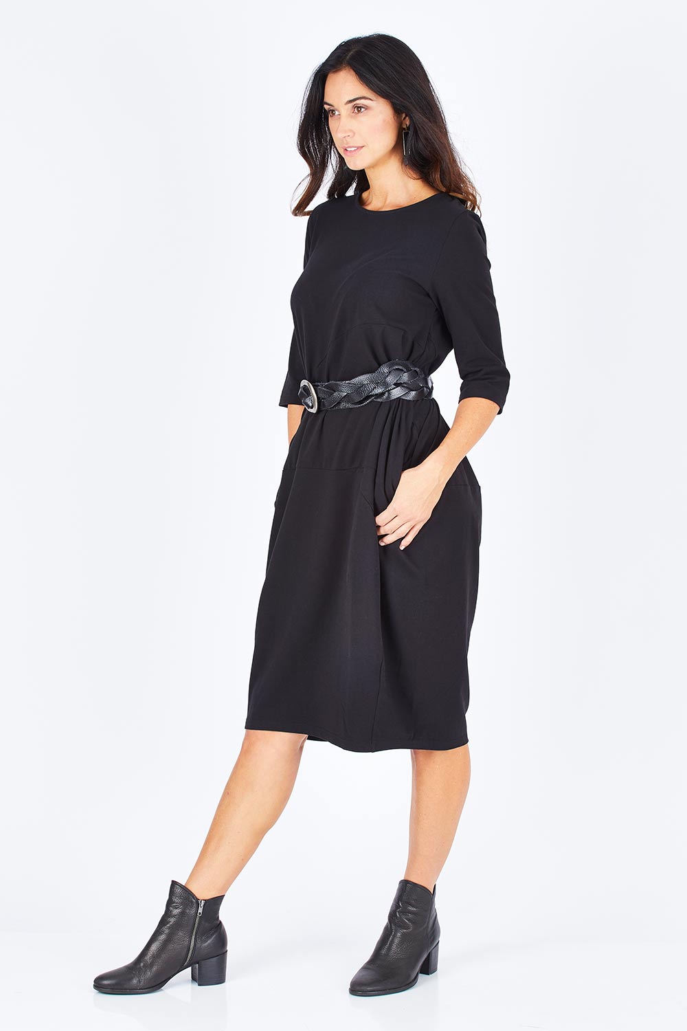 Model Gemma wearing size S of the Curved Seam Dress in colour Black (Black), from the front, showing the whole outfit