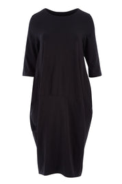 Product shot of the Curved Seam Dress in colour Black (Black), from the front