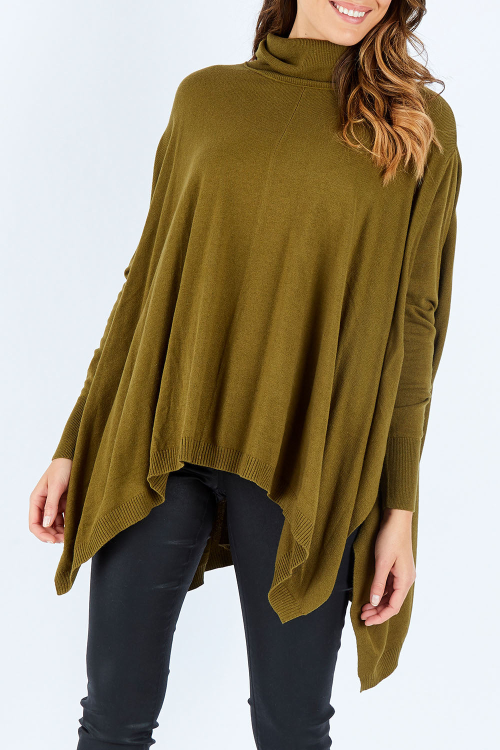 Model Madeline wearing size S of the Poncho Pullover in colour Moss (Green), from the front, cropped image