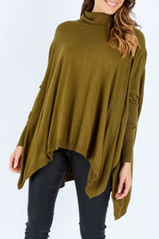 Model Madeline wearing size S of the Poncho Pullover in colour Moss (Green), from the front, cropped image