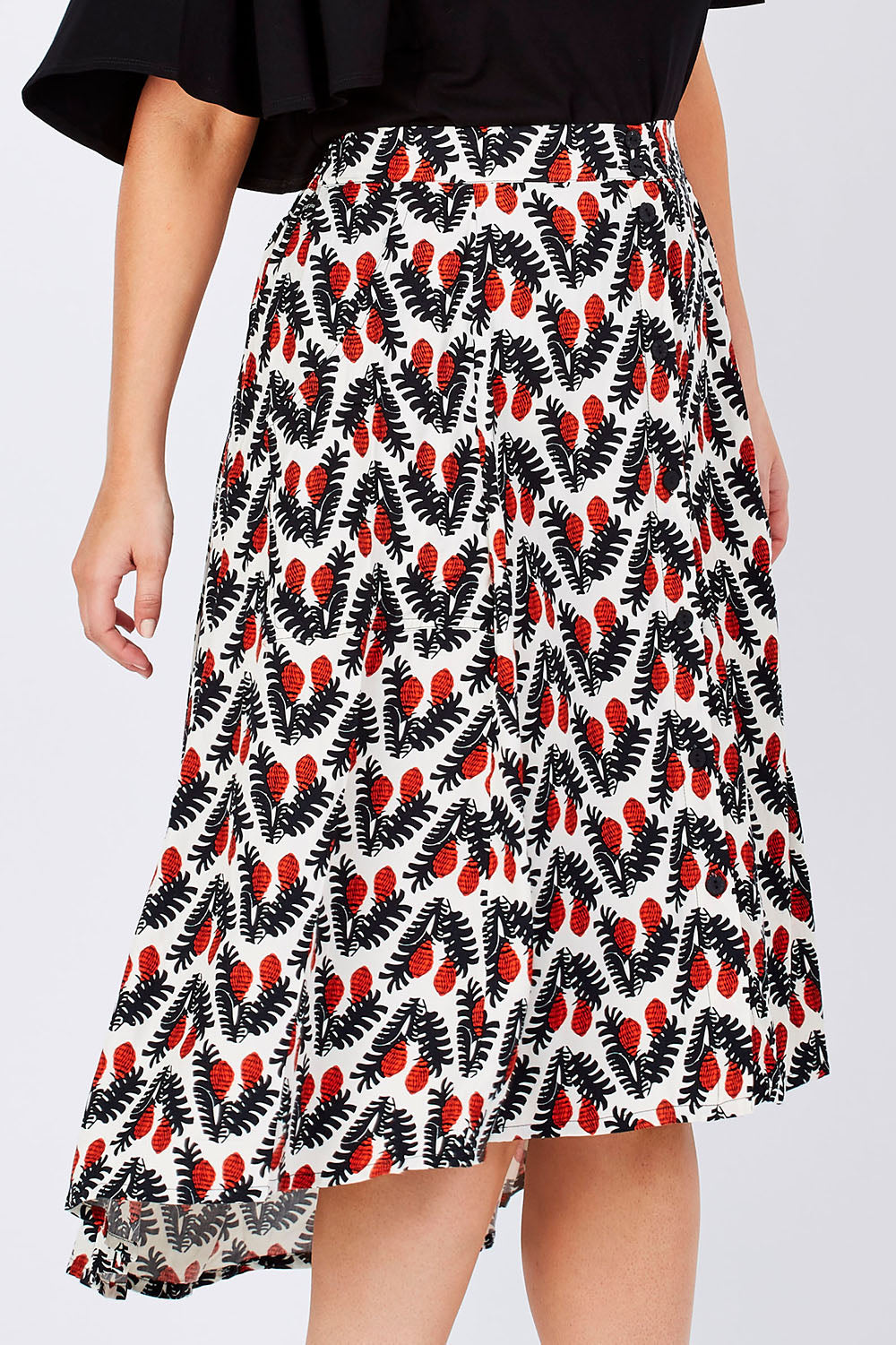 Model Jess wearing the Ayna Skirt in colour BayamCream, from the front, cropped image