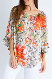 Model Anna wearing size S of the Shelby Top in colour Snake, from the front, cropped image