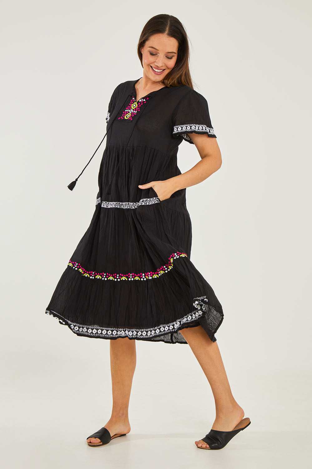 Model Georgia wearing size S of the Zeta Dress in colour Black (Black), from the front, showing the whole outfit