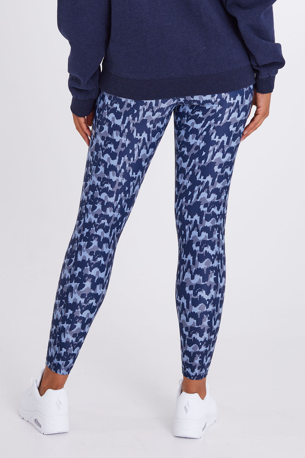 Model Olivia wearing size 10 of the Ab Waisted Power Moves Tights in colour Tallulah (Blue), from the back