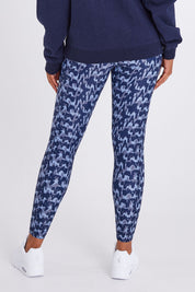 Model Olivia wearing size 10 of the Ab Waisted Power Moves Tights in colour Tallulah (Blue), from the back