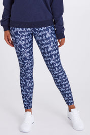 Model Olivia wearing size 10 of the Ab Waisted Power Moves Tights in colour Tallulah (Blue), from the front, cropped image