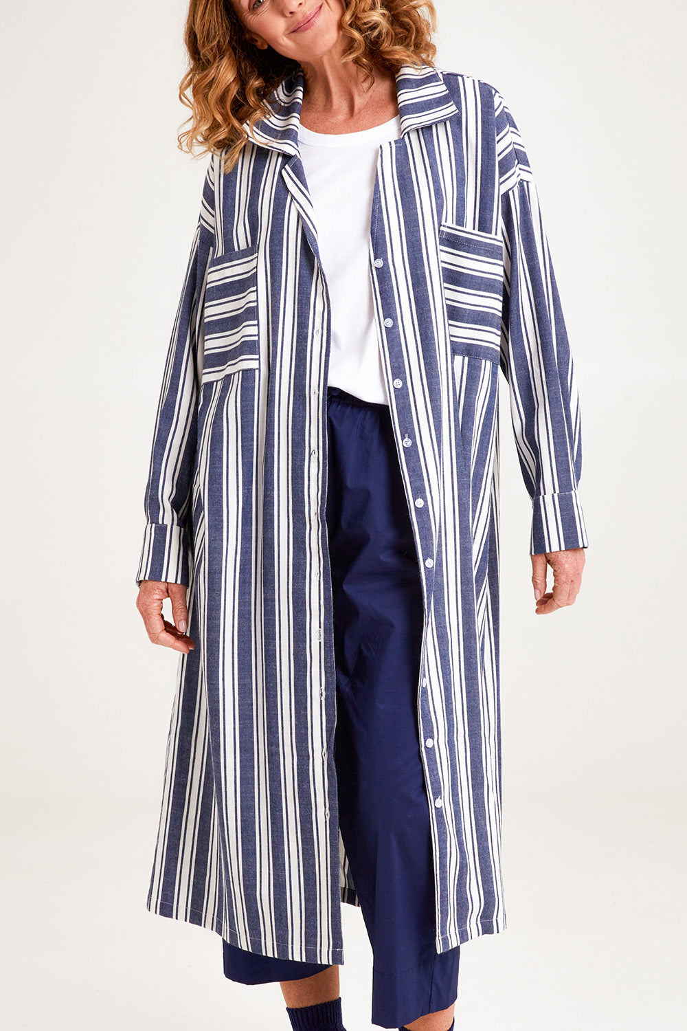 Model Emma wearing the Oversized Cotton Linen Sleep Shirt in colour Navystripe (Blue), from the front, cropped image