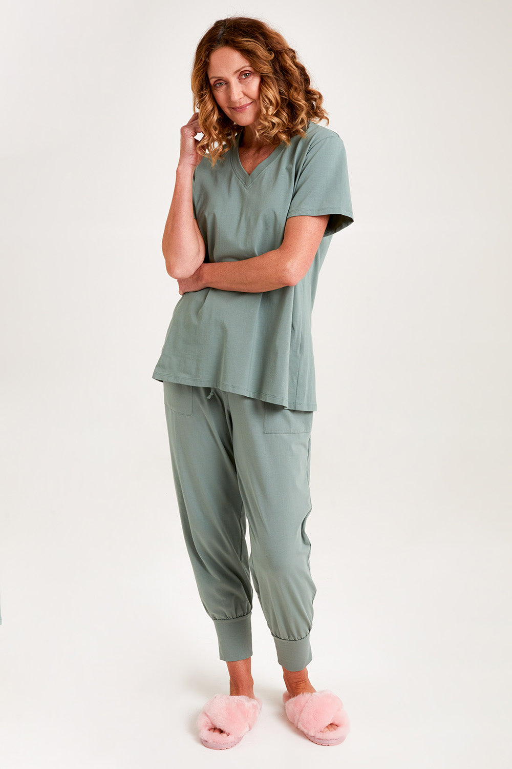 Model Emma wearing the Cotton Jersey V Neck Tee in colour Sage (Green), from the front, showing the whole outfit