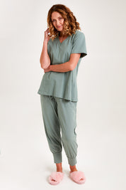 Model Emma wearing the Cotton Jersey V Neck Tee in colour Sage (Green), from the front, showing the whole outfit