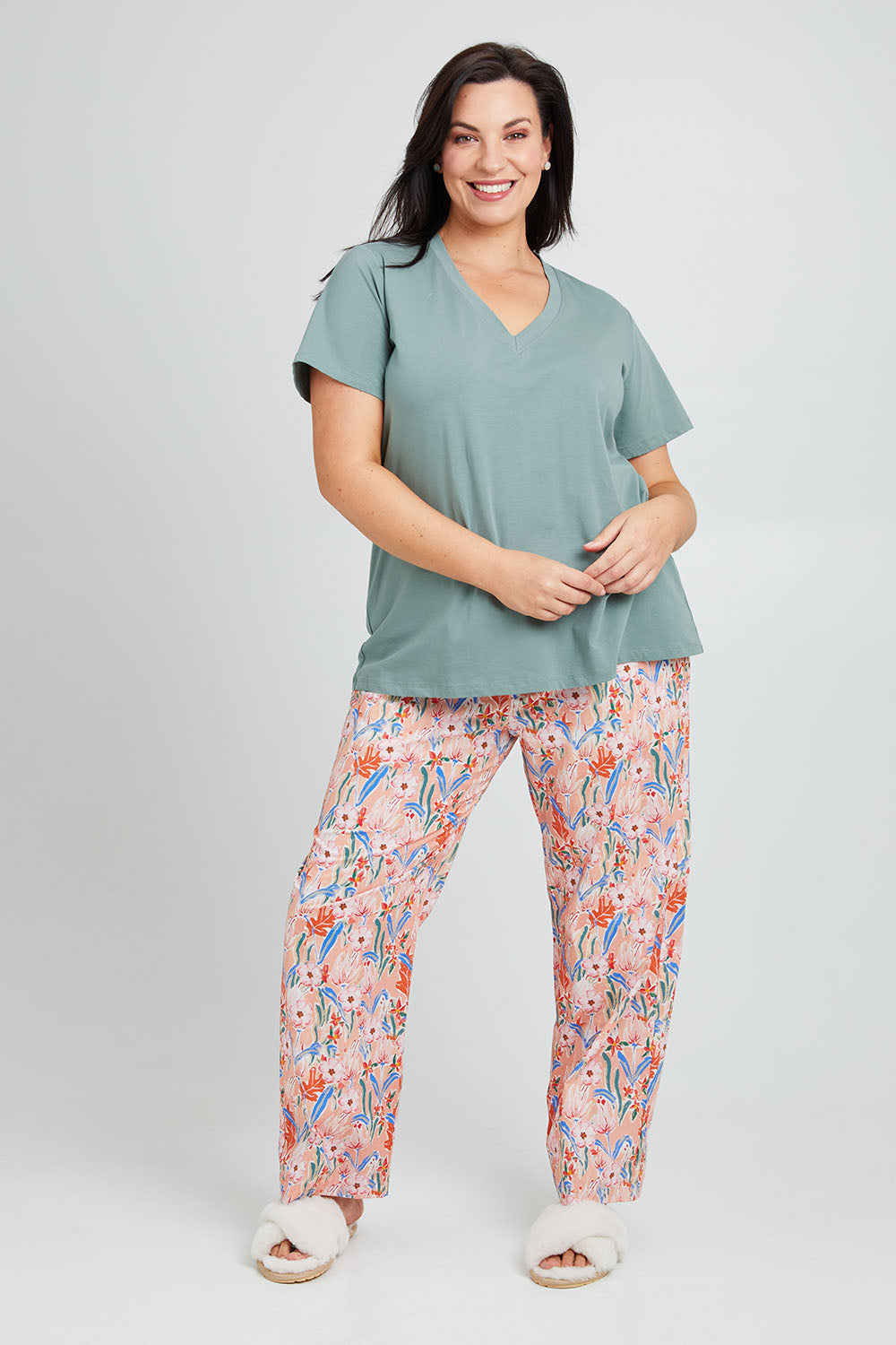 Model Poppy wearing the Cotton Jersey V Neck Tee in colour Sage (Green), from the front, showing the whole outfit