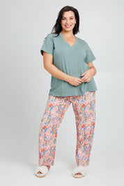 Model Poppy wearing the Cotton Jersey V Neck Tee in colour Sage (Green), from the front, showing the whole outfit