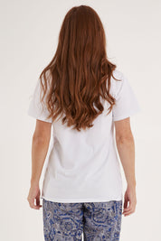 Model Sally wearing the Cotton Jersey V Neck Tee in colour White (White), from the back