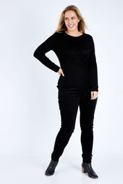 Model Jess wearing size 14 of the Skinny Leg Cord Pull On Pant in colour Black (Black), from the front, showing the whole outfit