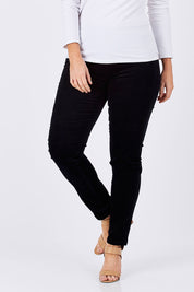 Model Laura wearing size 12 of the Skinny Leg Cord Pull On Pant in colour Black (Black), from the front, cropped image