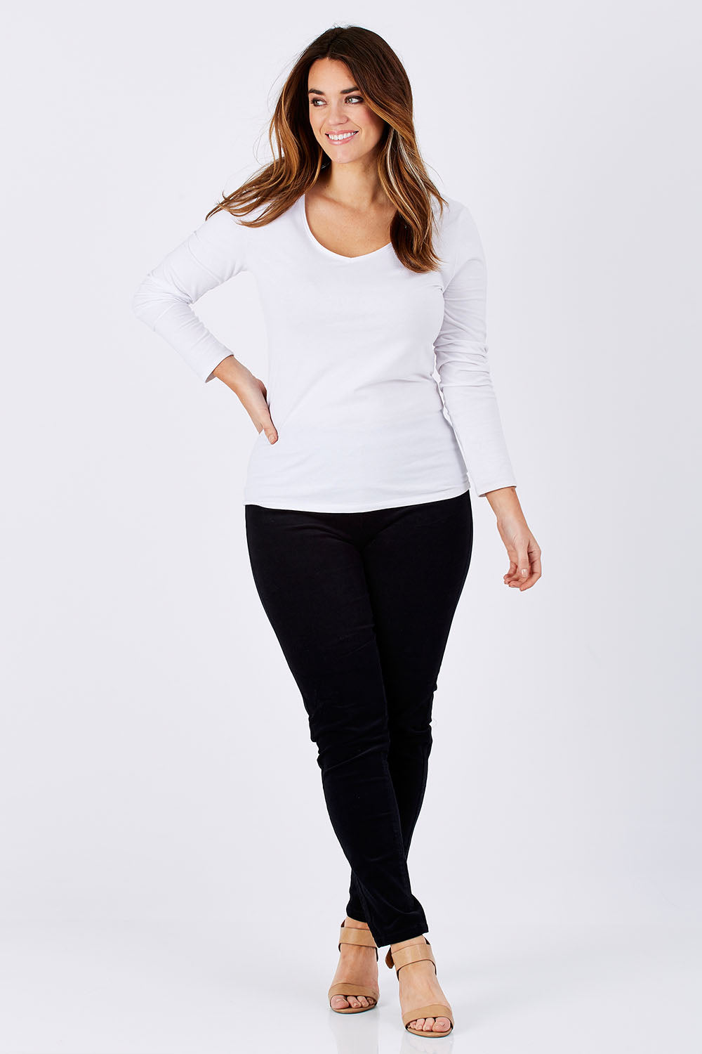 Model Laura wearing size 12 of the Skinny Leg Cord Pull On Pant in colour Black (Black), from the front, showing the whole outfit