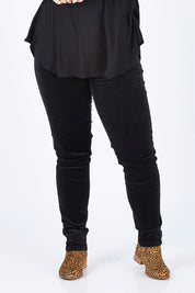 Model Sophie wearing size 14 of the Skinny Leg Cord Pull On Pant in colour Black (Black), from the front, cropped image