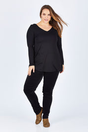 Model Sophie wearing size 14 of the Skinny Leg Cord Pull On Pant in colour Black (Black), from the front, showing the whole outfit