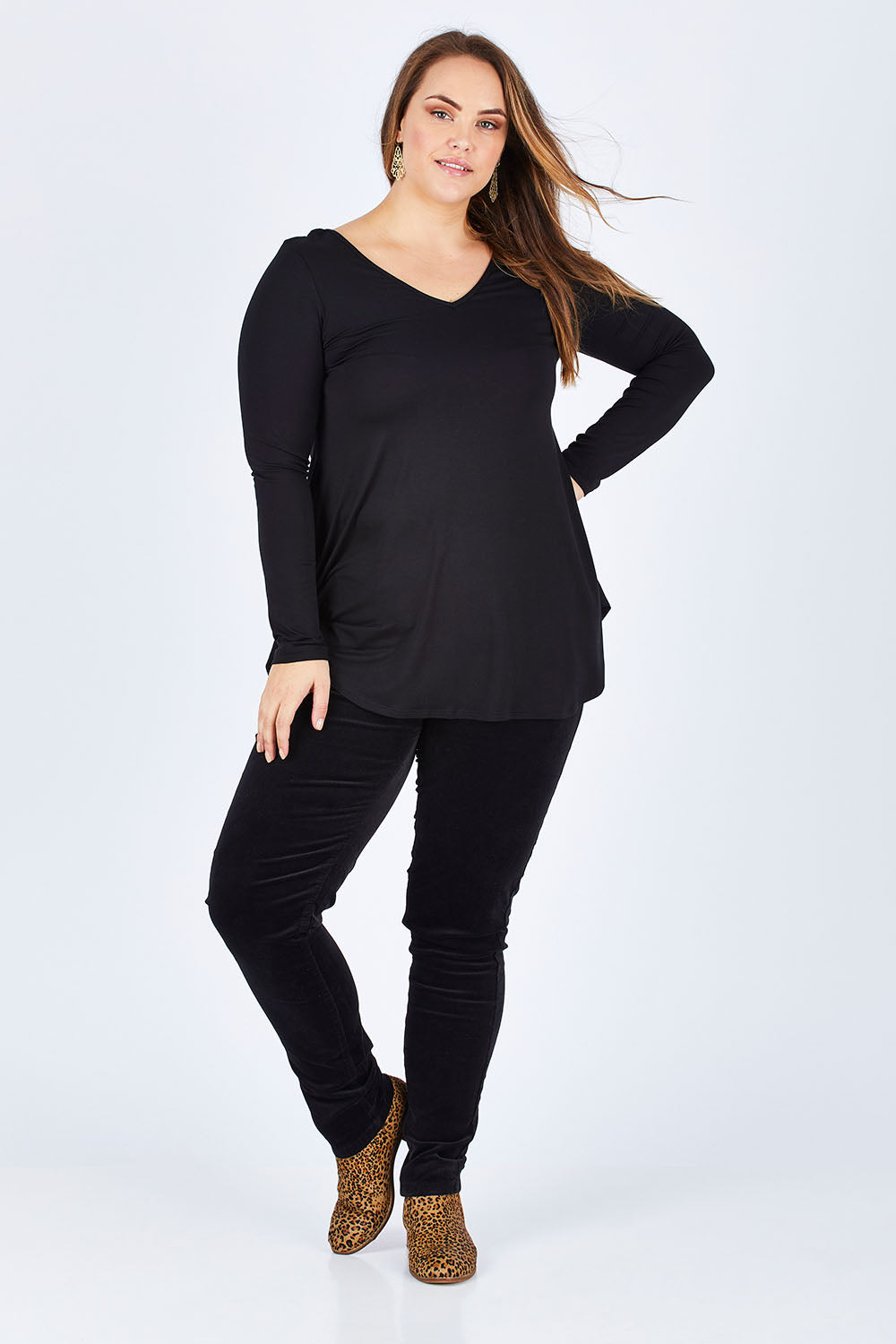 Model Sophie wearing size 14 of the Skinny Leg Cord Pull On Pant in colour Black (Black), from the front, showing the whole outfit