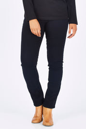 Model Summer wearing size 10 of the Skinny Leg Cord Pull On Pant in colour Black (Black), from the front, cropped image