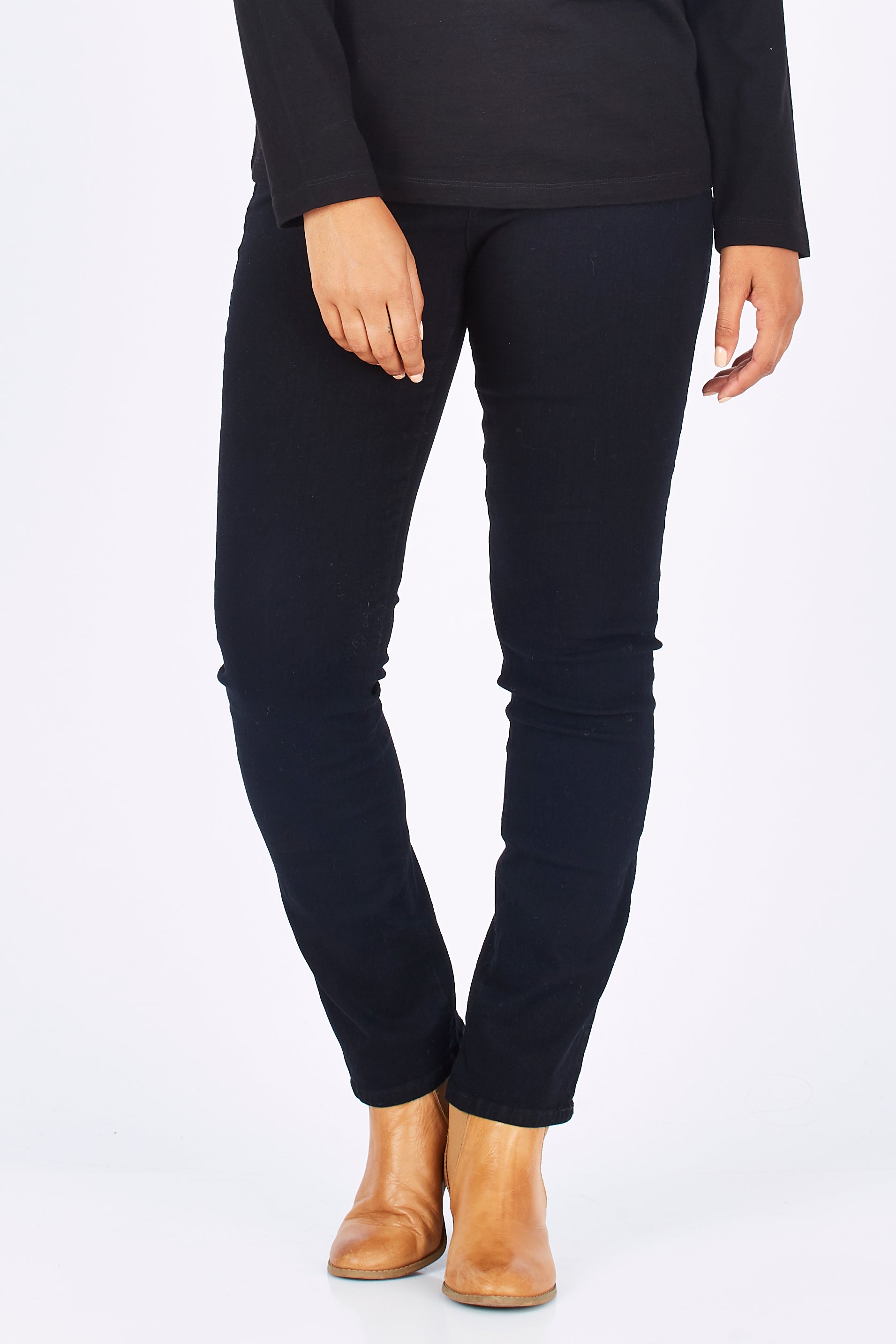 Model Summer wearing size 10 of the Skinny Leg Cord Pull On Pant in colour Black (Black), from the front, cropped image