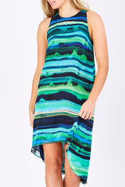 Model Maddy wearing size 10 of the Lianne Hiin colourLow Dress - GreenStri (Green), from the front, cropped image