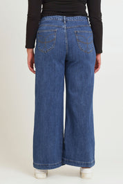 Model Chanel wearing size 16 of the Katie Highin colourWaisted Front Pocket Wide Leg Jean - Middenim (Blue), from the back