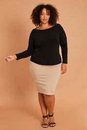 Model Alexis wearing size 16 of The Ponte Knee Length Pencil Skirt in colour Beige, from the front, showing the whole outfit