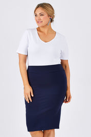 Model Ljubenka wearing size 18 of The Ponte Knee Length Pencil Skirt in colour Navy (Blue), from the front, cropped image