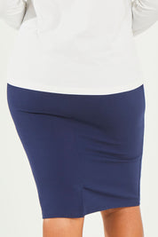 Model Noli wearing size 14 of The Ponte Knee Length Pencil Skirt in colour Navy (Blue), from the back