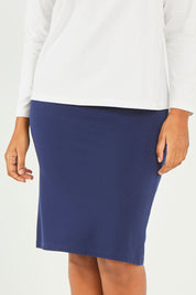Model Noli wearing size 14 of The Ponte Knee Length Pencil Skirt in colour Navy (Blue), from the front, cropped image