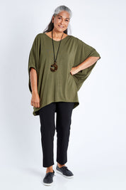 Model Nadine wearing size OneSize of the Vin colourNeck Bamboo Drape Top - Olive (Green), from the front, showing the whole outfit
