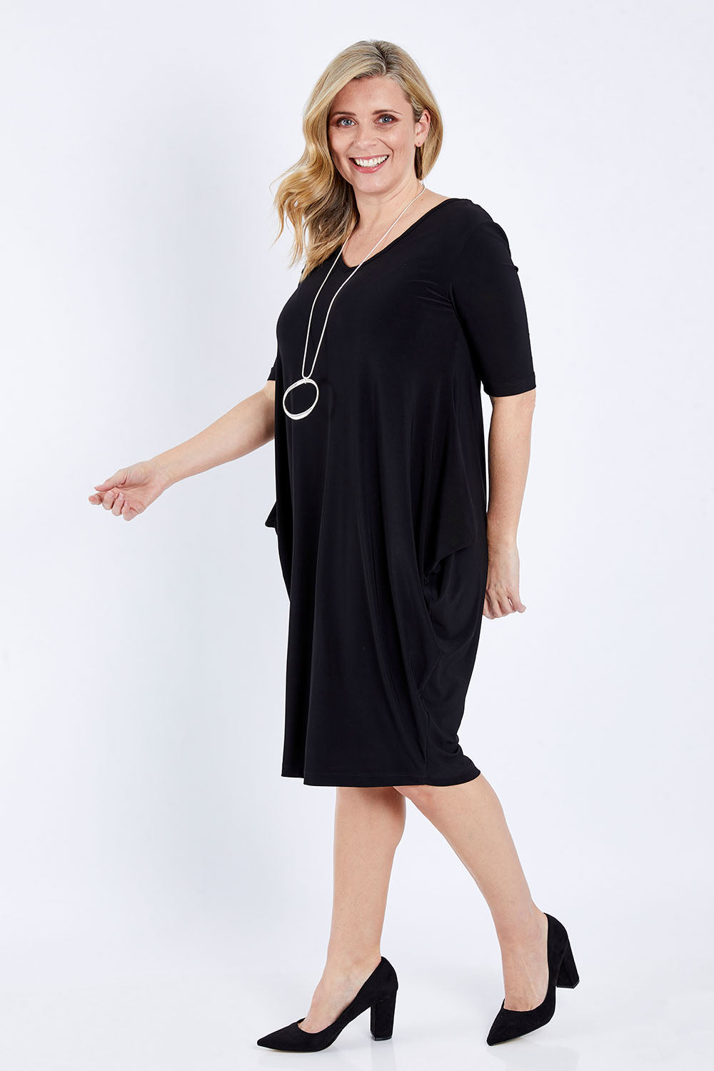 Model Brooke wearing size 10 of the Preloved Flowing V Neck Dress in colour Black (Black), from the front, showing the whole outfit