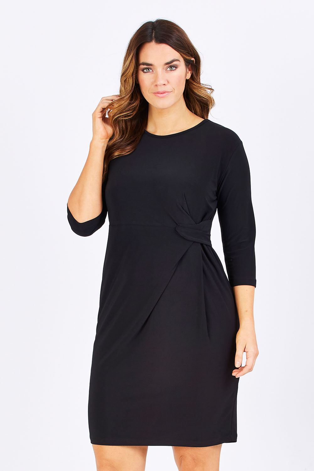 Model Laura wearing size 12 of the Side Cross Dress in colour Black (Black), from the front, cropped image