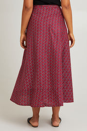 Model Olivia wearing size OneSize of the Grace Cotton Wrap Skirt in colour Corfu (Red), from the back