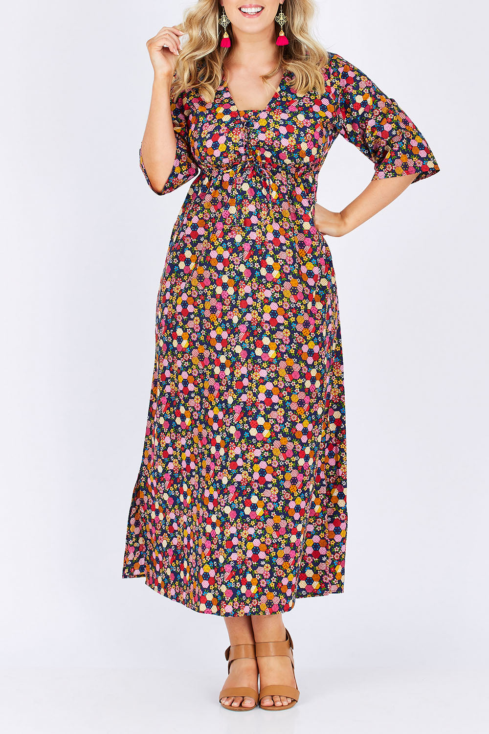 Model Jess wearing size M-L of the Gypsy Dress in colour Honshu (Black), from the front, cropped image