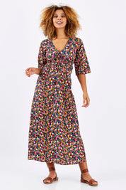 Model Summer wearing size S-M of the Gypsy Dress in colour Honshu (Black), from the front, showing the whole outfit