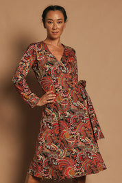 Model Katie wearing size S of the Sunburst Cotton Wrap Dress in colour Hackney, from the front, cropped image