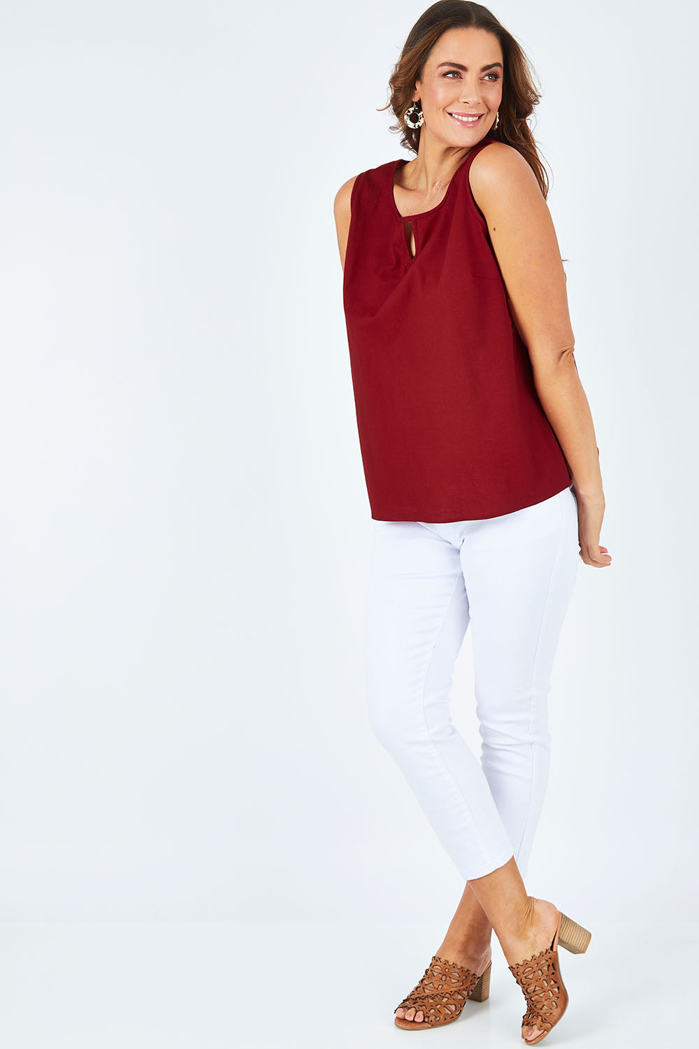Model Abby wearing size L of the Martine Top in colour Maroon (Red), from the front, showing the whole outfit