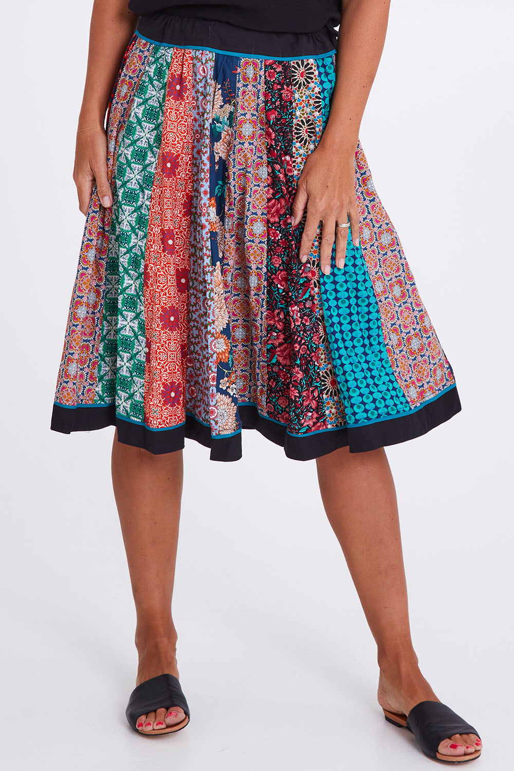 Model Alex wearing size OneSize of the Gypsy Panel Skirt in colour Multiprint (Blue), from the front, cropped image