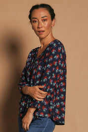Model Katie wearing the Palais Top in colour Soho (Blue), from the front, showing the whole outfit